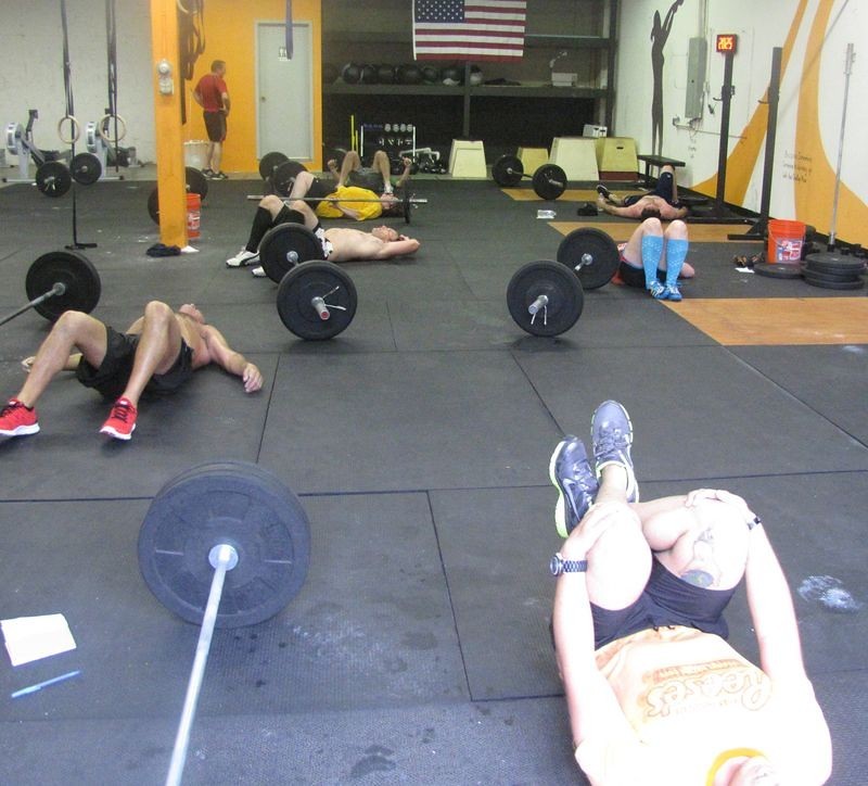 loaded carries causes exhaustion in a group of exercising athletes