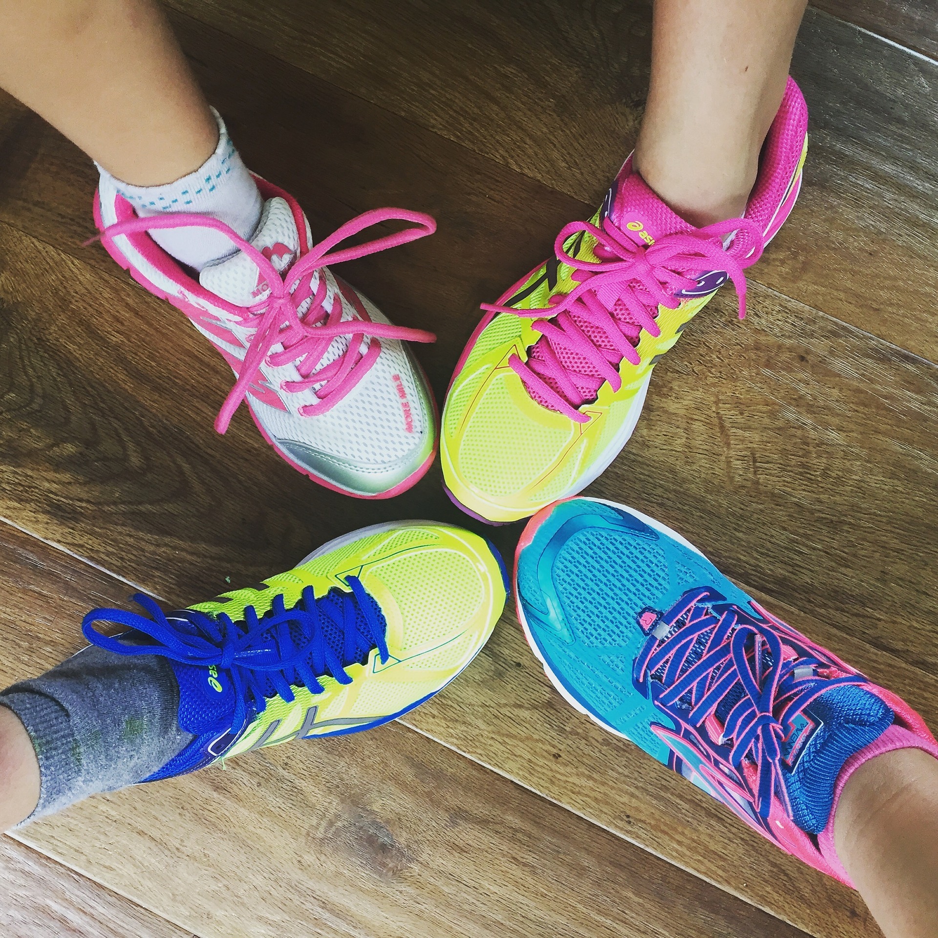 brightly colored running trainers with friends